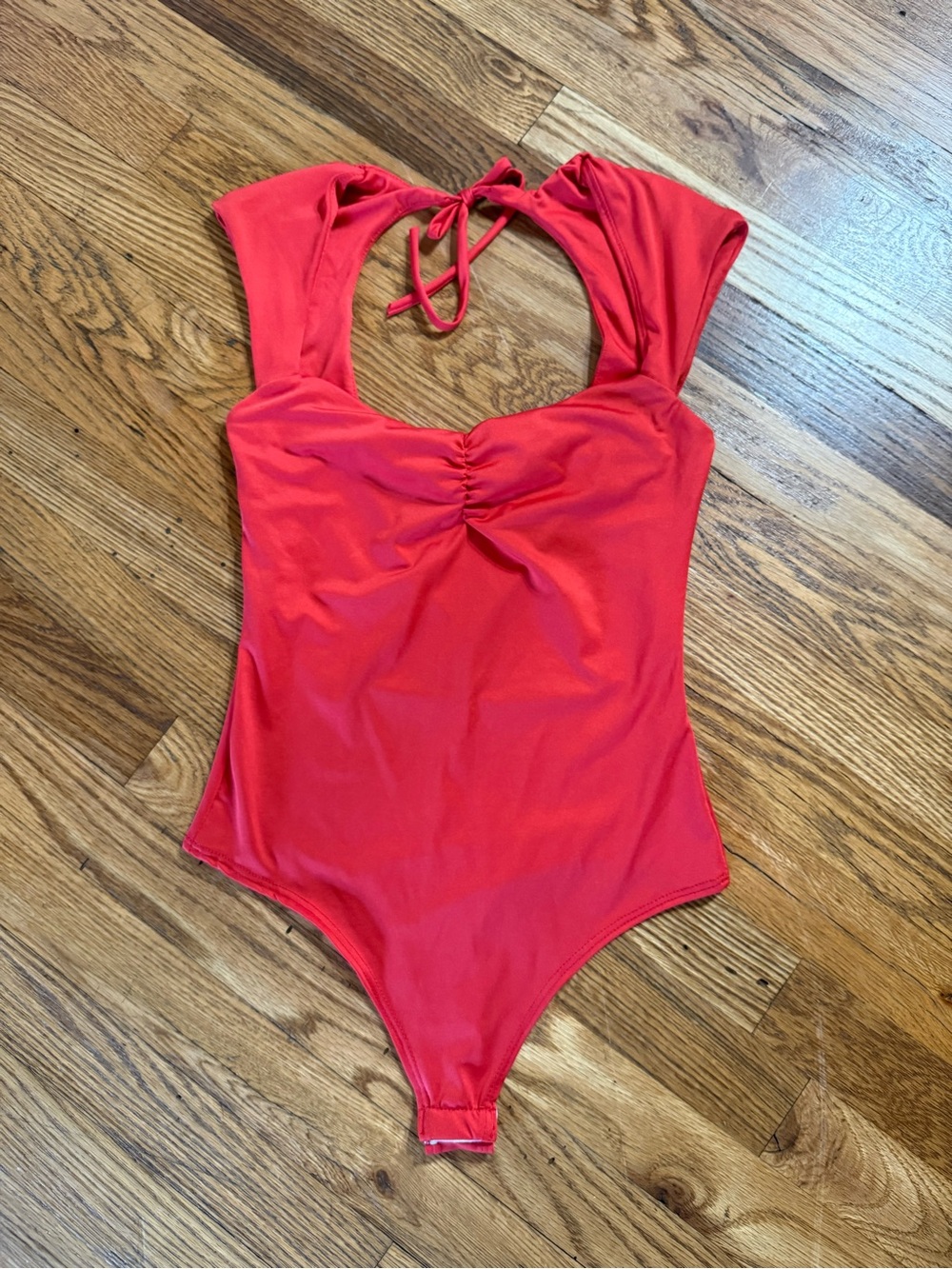 Women’s red bodysuit